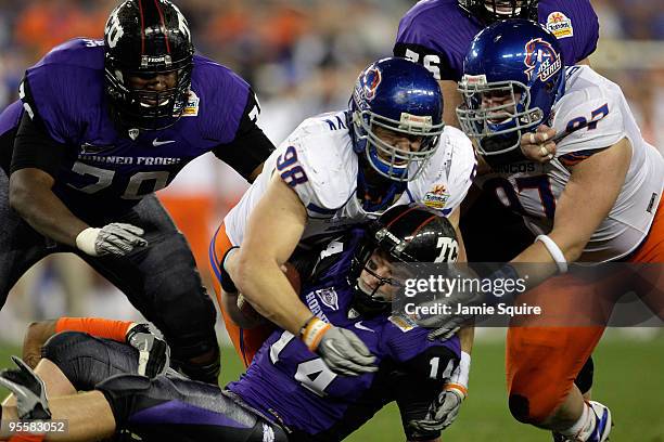 Ryan Winterswyk of the Boise State Broncos tackles quarterback Andy Dalton of the TCU Horned Frogs on a quarterback keeper in the third quarter...