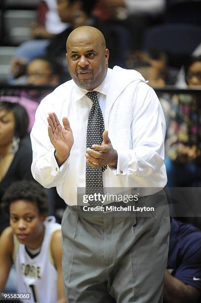 Mike Bozeman, head coach of the George Washington Colonials looks on during a women's college basketball game against the Rutgers Scarlet Knight on...