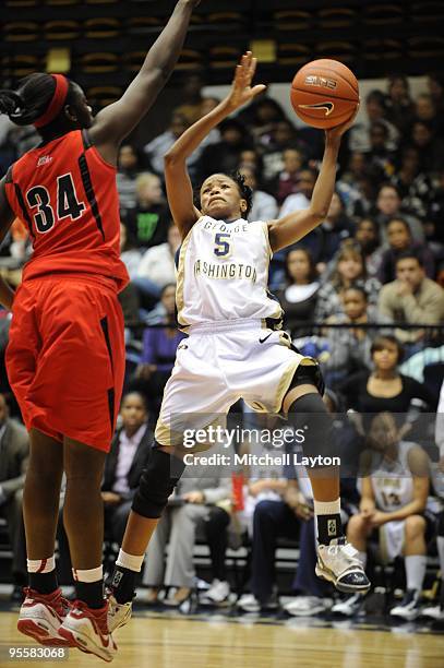 Tiana Myers of the George Washington Colonials drives to the basket during a women's college basketball game against the Rutgers Scarlet Knight on...