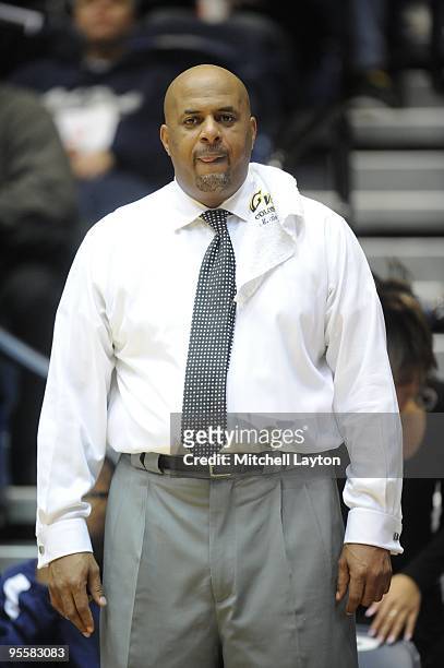 Mike Bozeman, head coach of the George Washington Colonials looks on during a women's college basketball game against the Rutgers Scarlet Knight on...