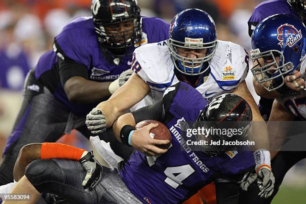 Ryan Winterswyk of the Boise State Broncos tackles quarterback Andy Dalton of the TCU Horned Frogs on a quarterback keeper in the third quarter...