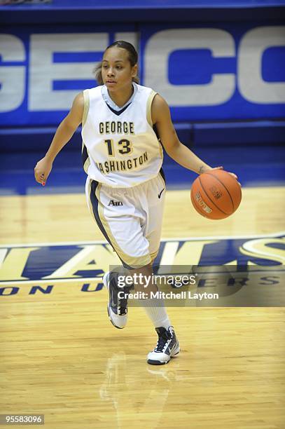 Janine Davis of the George Washington Colonials dribbles the ball during a women's college basketball game against the Rutgers Scarlet Knight on...