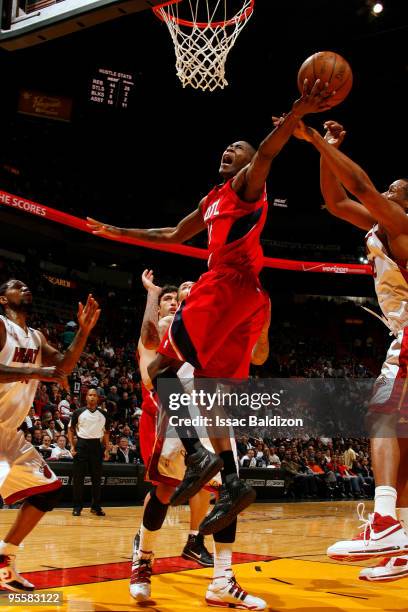 Jamal Crawford of the Atlanta Hawks grabs a rebound against the Miami Heat on January 4, 2010 at American Airlines Arena in Miami, Florida. NOTE TO...