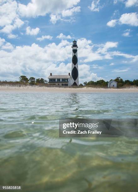 cape lookout lighthouse across the sound - cape lookout national seashore stock pictures, royalty-free photos & images