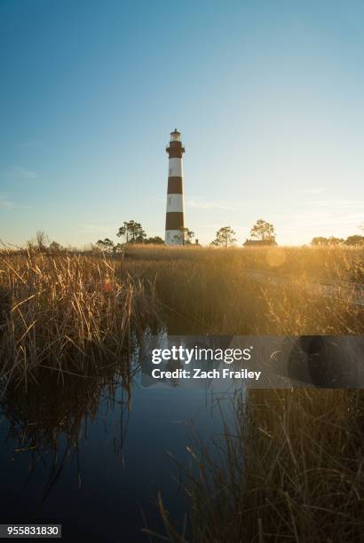 bodie island lighthouse at sunset - outer banks stock pictures, royalty-free photos & images