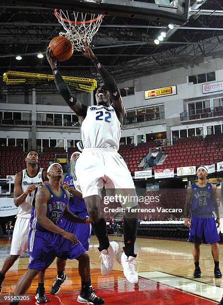 Mo Charlo of the Reno Bighorns goes to the basket against Maurice Baker of the Dakota Wizards during the 2010 D-League Showcase at Qwest Arena on...