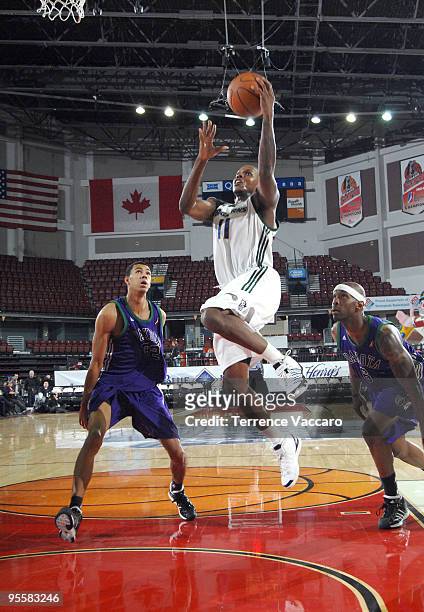 Russell Robinson of the Reno Bighorns goes to the basket against Romel Beck of the Dakota Wizards during the 2010 D-League Showcase at Qwest Arena on...