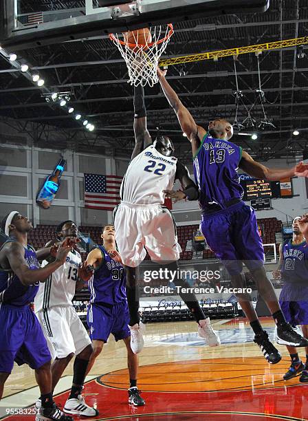 Marcus Dove of the Dakota Wizards goes to the basket against Mo Charlo of the Reno Bighorns during the 2010 D-League Showcase at Qwest Arena on...