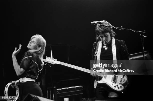 Linda and Paul McCartney perform live with Wings at The Cow Palace in 1974 in San Francisco, California.