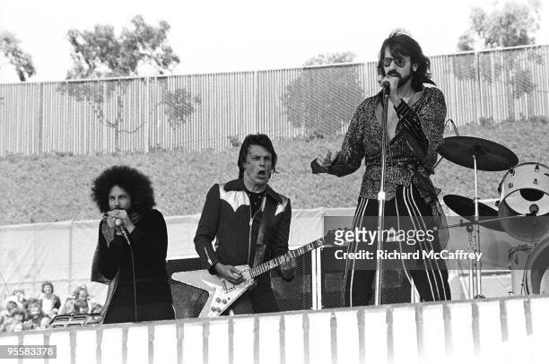 Richard "Magic Dick" Salwitz, J. Geils and Peter Wolf of The J. Geils Band perform live at The Oakland Coliseum in 1976 in Oakland, California.