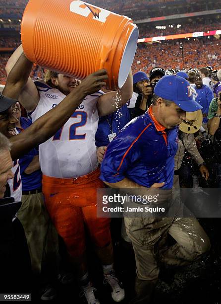 Matt Slater of the Boise State Broncos dumps Gatorade over head coach Chris Petersen after the Broncos 17-10 victory against the TCU Horned Frogs...