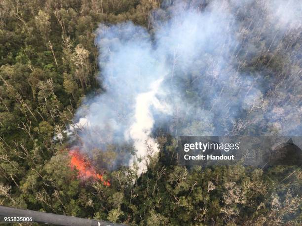 In this handout photo provided by the U.S. Geological Survey, ground cracking extends across Highway 130 on May 7, 2018 in Puna, Hawaii. Kilauea...