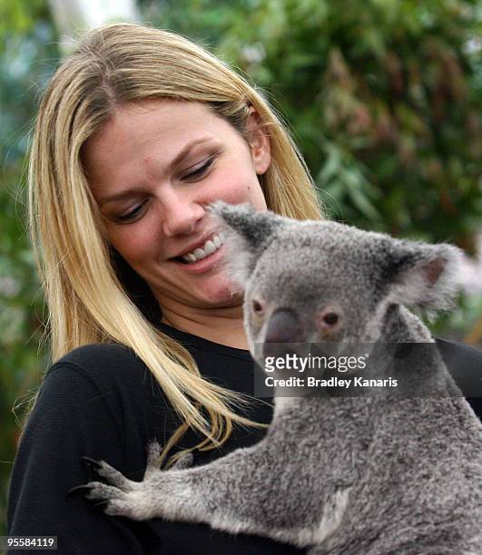 Model Brooklyn Decker takes time out from watching husband Andy Roddick of the USA play in the Brisbane International 2010 to hold a Koala at the...