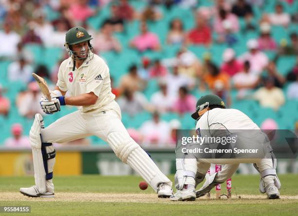 Michael Hussey of Australia is dropped by Kamran Akmal of Pakistan during day three of the Second Test match between Australia and Pakistan at Sydney...