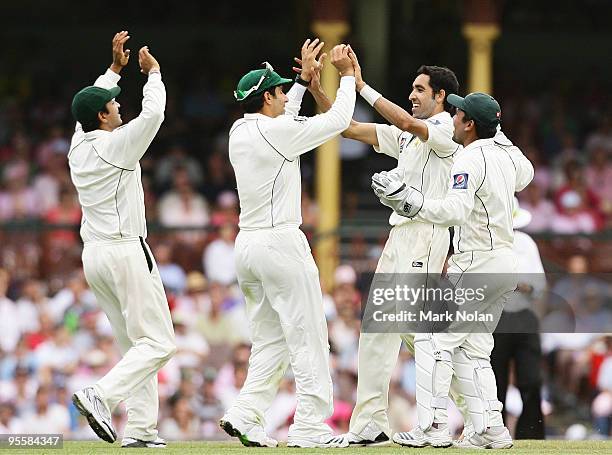 Umar Gul of Pakistan celebrates getting the wicket of Nathan Hauritz of Australia during day three of the Second Test match between Australia and...