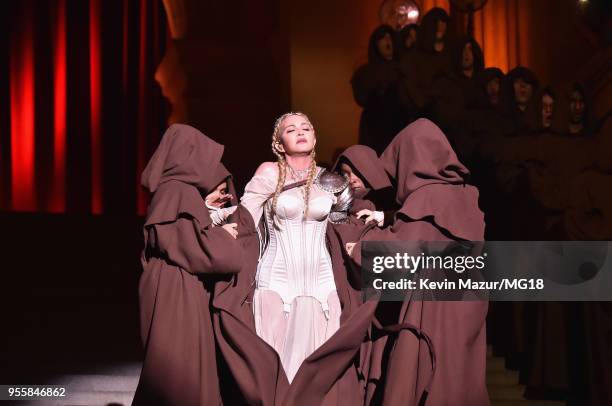 Madonna performs during the Heavenly Bodies: Fashion & The Catholic Imagination Costume Institute Gala at The Metropolitan Museum of Art on May 7,...