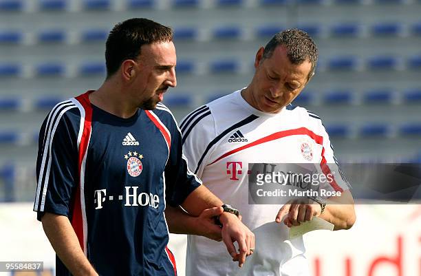 Physiotherapist Giovanni Bianci of Bayern Muenchen takes care of Franck Ribery during the FC Bayern Muenchen training session at the Al Nasr training...