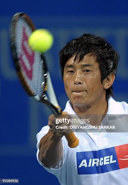 Indian football captain Baichung Bhutia plays a return during a promotional tennis match during the ATP Chennai Open 2010, in Chennai on January 4,...