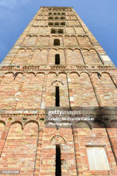 pomposa abbey romanesque bell tower as seen from directly below in codigoro, emilia-romagna, italy - codigoro stock pictures, royalty-free photos & images