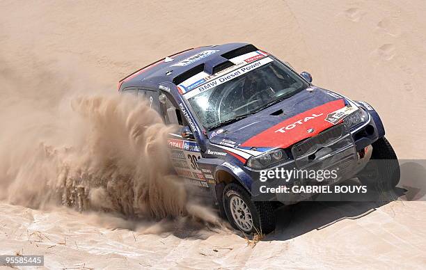 France's Stephane Peterhansel steers his BMW during the 3rd stage of the Dakar 2010 between La Rioja and Fiambala, Argentina, on January 4, 2010....