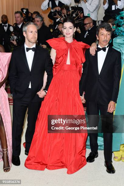 Adam Shulman, Anne Hathaway and Pierpaolo Piccioli attend the Heavenly Bodies: Fashion & The Catholic Imagination Costume Institute Gala at the...