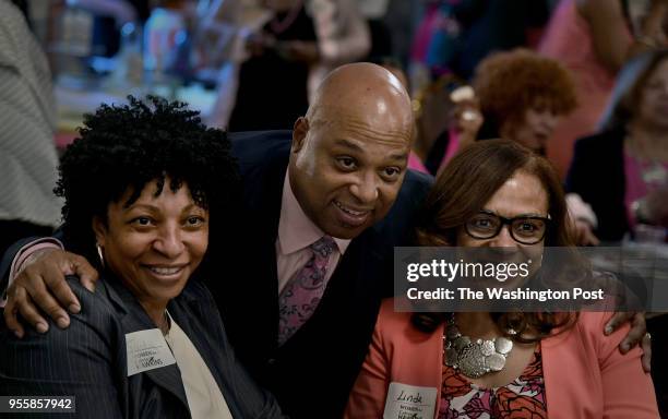 Calvin Hawkins poses for a photo with supporters Judy Richardson Linda Riggins and at his fund-raising event. Hawkins attended a fund-raising event...