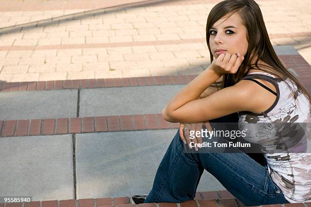 teenage girl on steps - moving down to seated position stock pictures, royalty-free photos & images