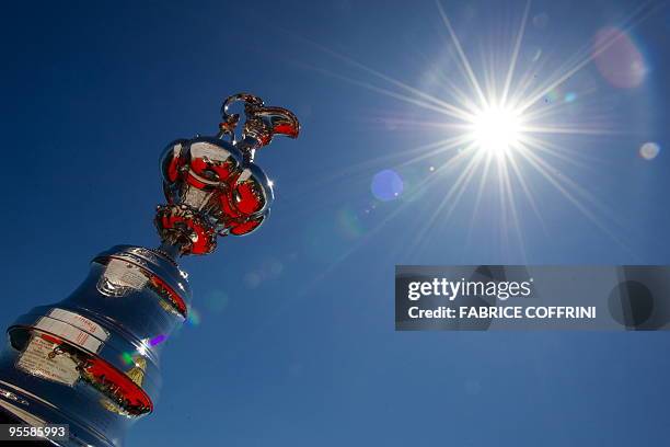 America's Cup trophy is seen during the parade of defender new giant high tech catamaran "Alinghi 5" at Lake Geneva on the Swiss national day on...