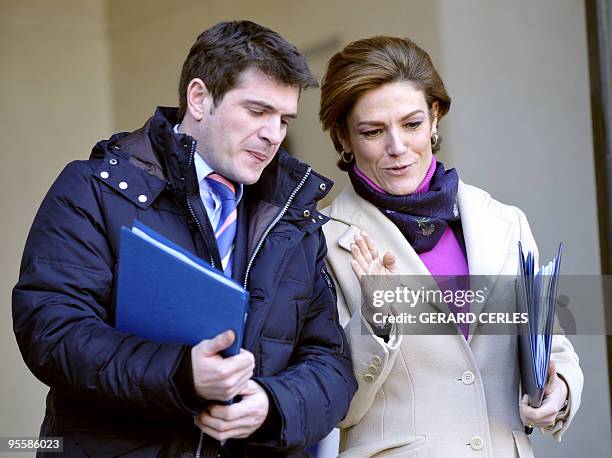 French Junior minister for Ecology Chantal Jouanno and French Housing and Urban Affairs Junior minister Benoit Apparu leave the first weekly cabinet...