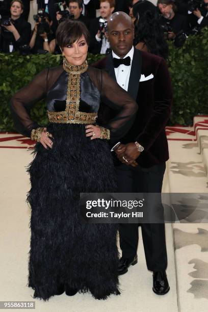 Kris Jenner and Corey Gamble attend "Heavenly Bodies: Fashion & the Catholic Imagination", the 2018 Costume Institute Benefit at Metropolitan Museum...