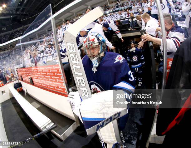 Goaltender Steve Mason of the Winnipeg Jets hits the ice for the start of the pre-game warm up prior to NHL action against the Nashville Predators in...