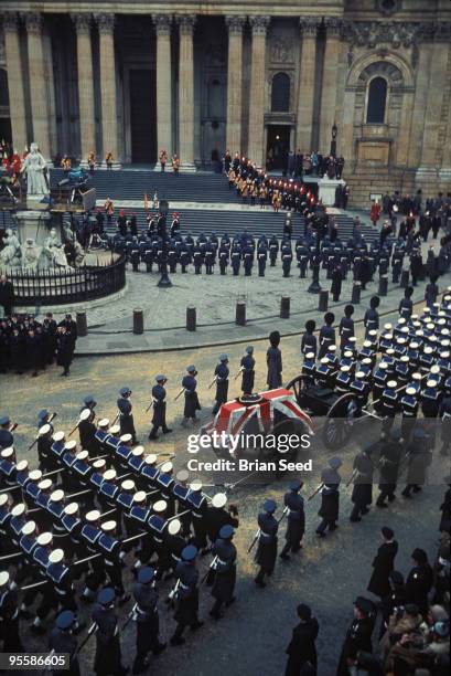 Sir Winston Churchill's funeral procession leaving St Paul's Cathedral, January 30 his coffin covered with the Union Jack flag on which rests his...