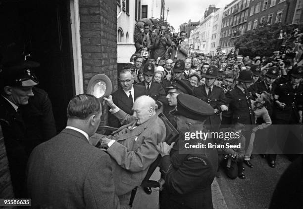England, Sir Winston Churchill returns to his Hyde Park London home in August 1962 after a stay in Middlesex Hospital, London. He broke his hip iat...