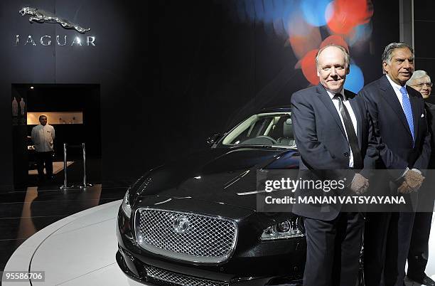 Chief Designer Jaguar Ian Callum and India's Tata group Chairman Ratan Tata pose with the newly unveiled Jaguar XJ car during the 10th Auto Expo in...