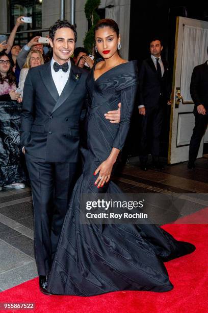 Zac Posen and Imaan Hammam depart the Carlyle Hotel to attend Heavenly Bodies: Fashion & The Catholic Imagination Costume Institute Gala on May 7,...