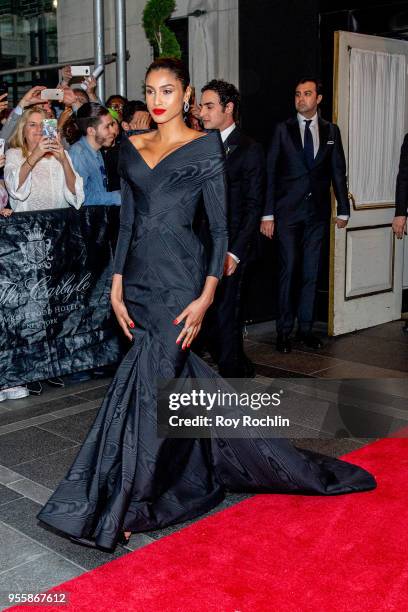 Zac Posen and Imaan Hammam depart the Carlyle Hotel to attend Heavenly Bodies: Fashion & The Catholic Imagination Costume Institute Gala on May 7,...