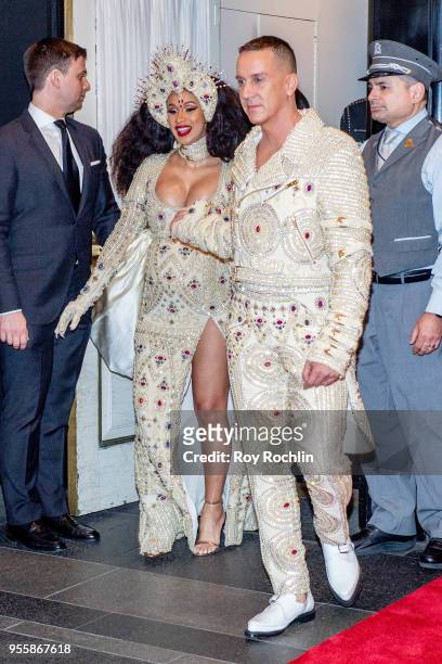 Cardi B and Jeremy Scott depart the Carlyle Hotel to attend Heavenly Bodies: Fashion & The Catholic Imagination Costume Institute Gala on May 7, 2018...