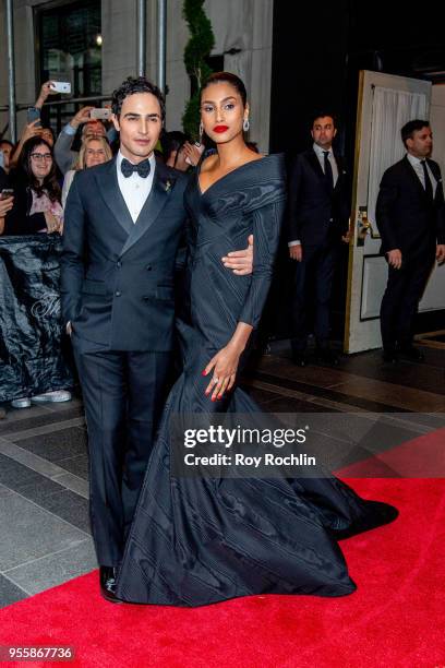 Zac Posen and Imaan Hammam depart the Carlyle Hotel to attend Heavenly Bodies: Fashion & The Catholic Imagination Costume Institute Gala on May 7,...