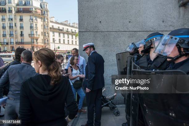 People willing to take their tren are being checked at the entrance of the Montparnasse train station, in Paris, France, on May 7, 2018.