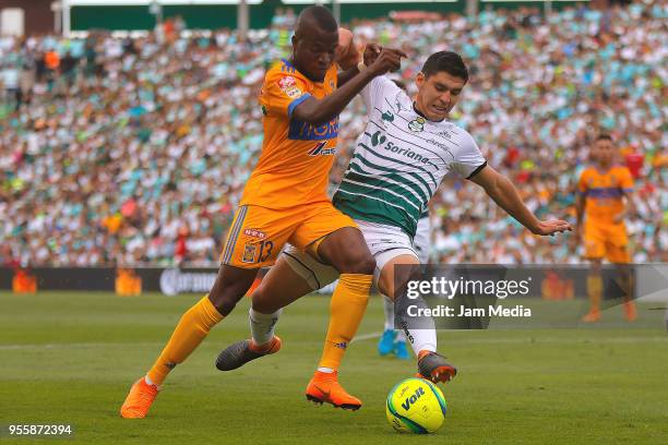 Enner Valencia of Tigres and Jesus Angulo of Santos fight for the ball during the quarter finals second leg match between Santos Laguna and Tigres...