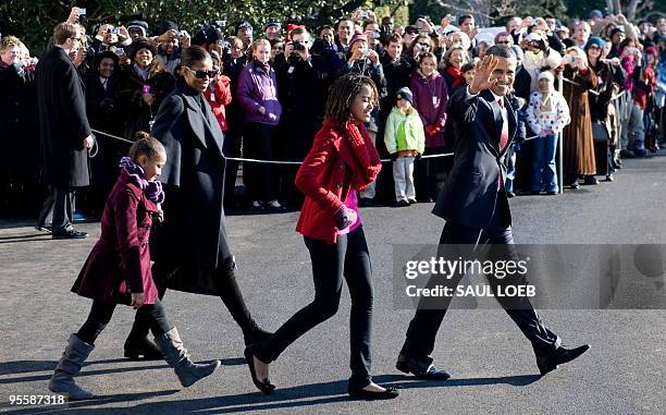 President Barack Obama walks with his daughters, Malia Obama and Sasha Obama and First Lady Michelle Obama to Marine One prior to departure from the...