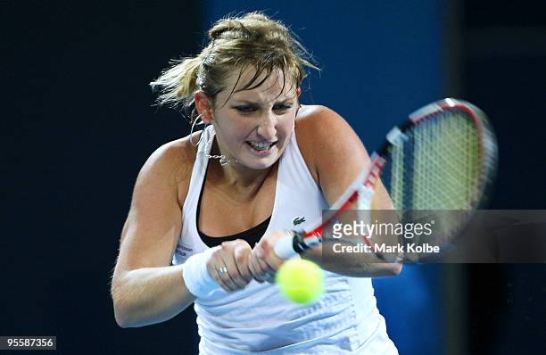 Timea Bacsinszky of Switzerland palys a backhand in her second round match against Ana Ivanovic of Serbia during day three of the Brisbane...