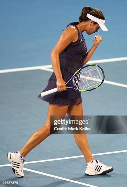 Ana Ivanovic of Serbia celebrates winning the first set in her second round match against Timea Bacsinszky of Switzerland during day three of the...