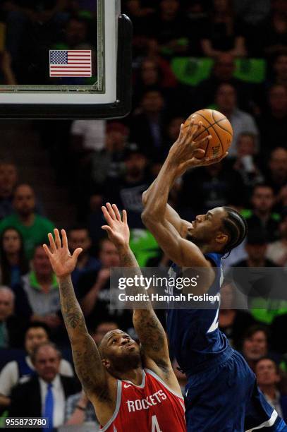 Andrew Wiggins of the Minnesota Timberwolves shoots the ball against PJ Tucker of the Houston Rockets in Game Four of Round One of the 2018 NBA...