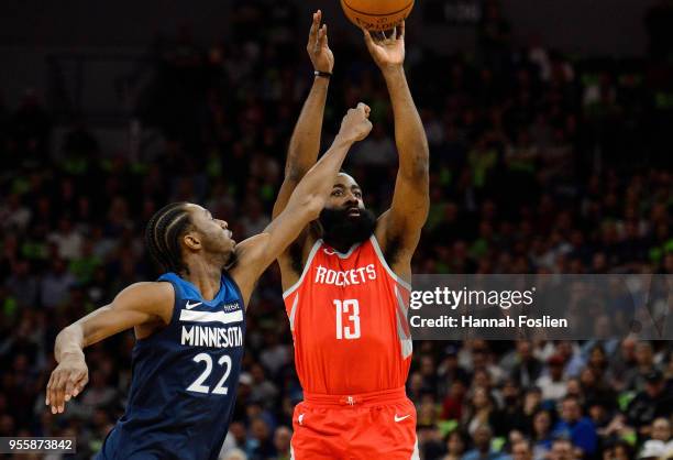 James Harden of the Houston Rockets shoots the ball Andrew Wiggins of the Minnesota Timberwolves in Game Four of Round One of the 2018 NBA Playoffs...