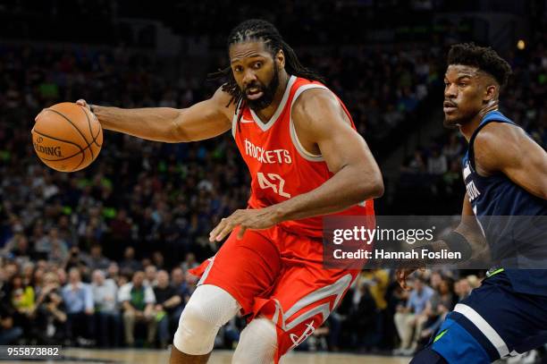 Nene Hilario of the Houston Rockets drives to the basket against Jimmy Butler of the Minnesota Timberwolves in Game Four of Round One of the 2018 NBA...