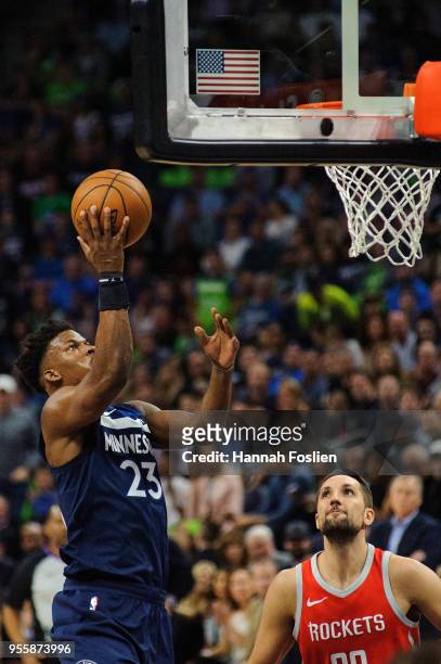 Jimmy Butler of the Minnesota Timberwolves shoots the ball against Ryan Anderson of the Houston Rockets in Game Four of Round One of the 2018 NBA...