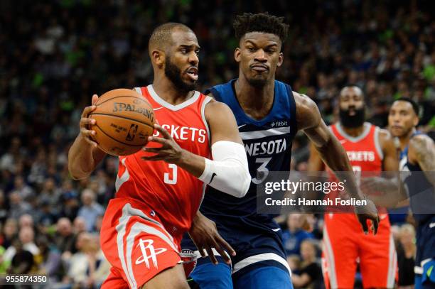Chris Paul of the Houston Rockets drives to the basket against Jimmy Butler of the Minnesota Timberwolves in Game Four of Round One of the 2018 NBA...