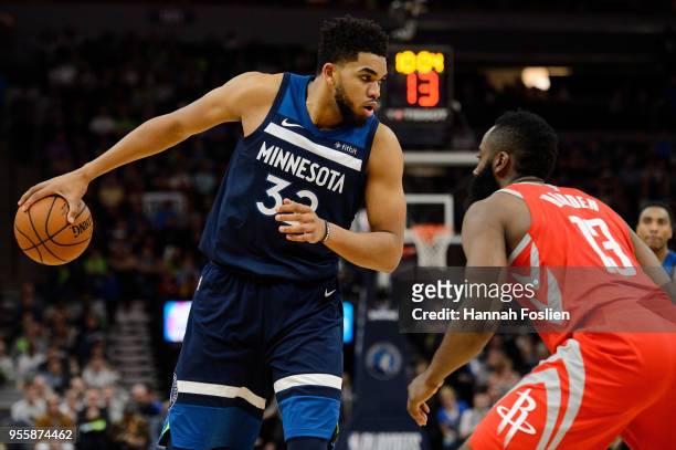 Karl-Anthony Towns of the Minnesota Timberwolves has the ball against James Harden of the Houston Rockets in Game Four of Round One of the 2018 NBA...