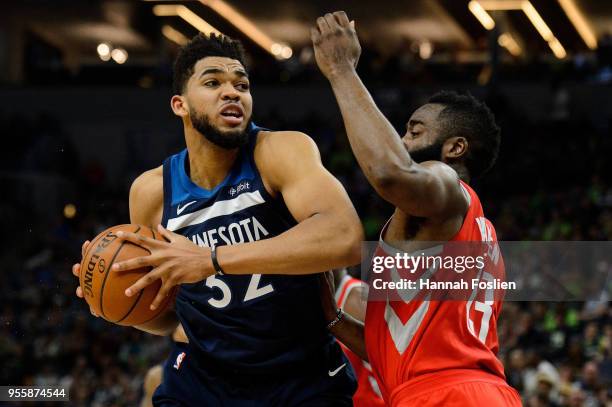 James Harden of the Houston Rockets defends against Karl-Anthony Towns of the Minnesota Timberwolves in Game Four of Round One of the 2018 NBA...